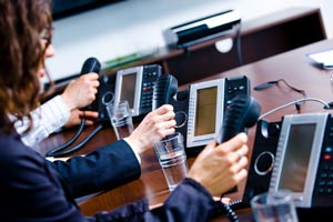 3 Business Phones lined up on a desk