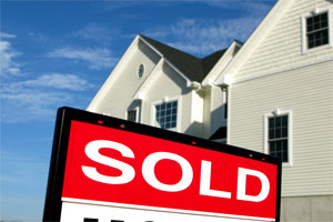 Sign in front of a property with SOLD on it